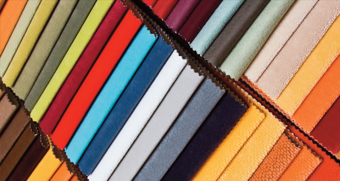 Fabric swatches arranged diagonally in a wide range of colors including red, blue, orange, green, and beige